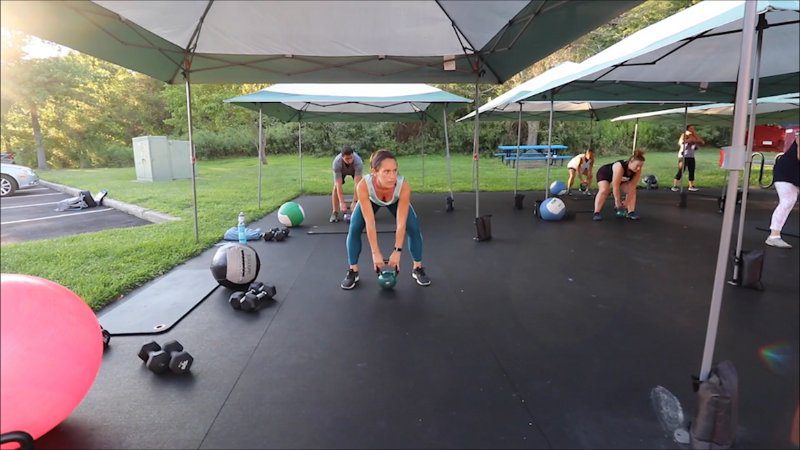 Gym members workout during an outdoor fitness class at an Atlantic Highlands gym